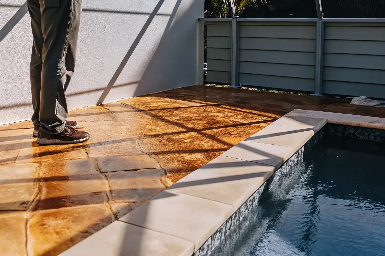 Decorative concrete pool deck in Naples FL with warm stone texture